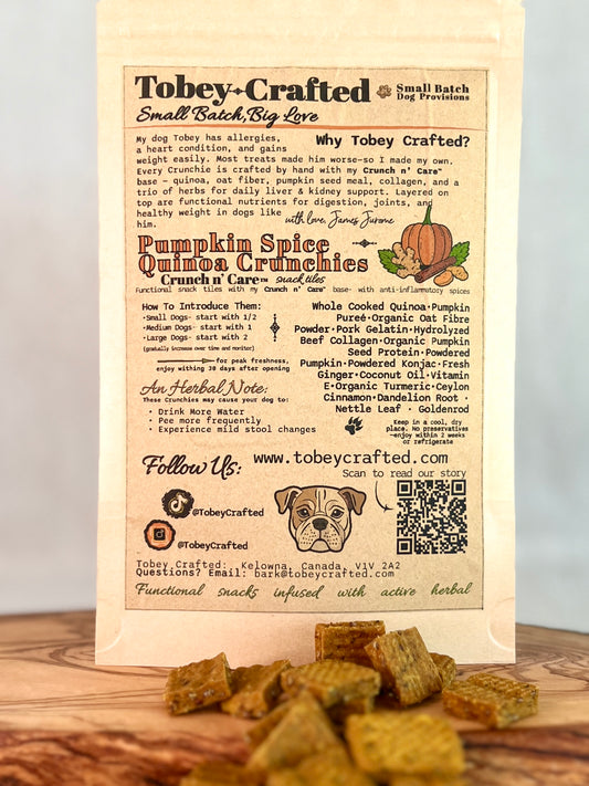 Tobey-Crafted dog treat packaging with text and a QR code on a wooden surface.