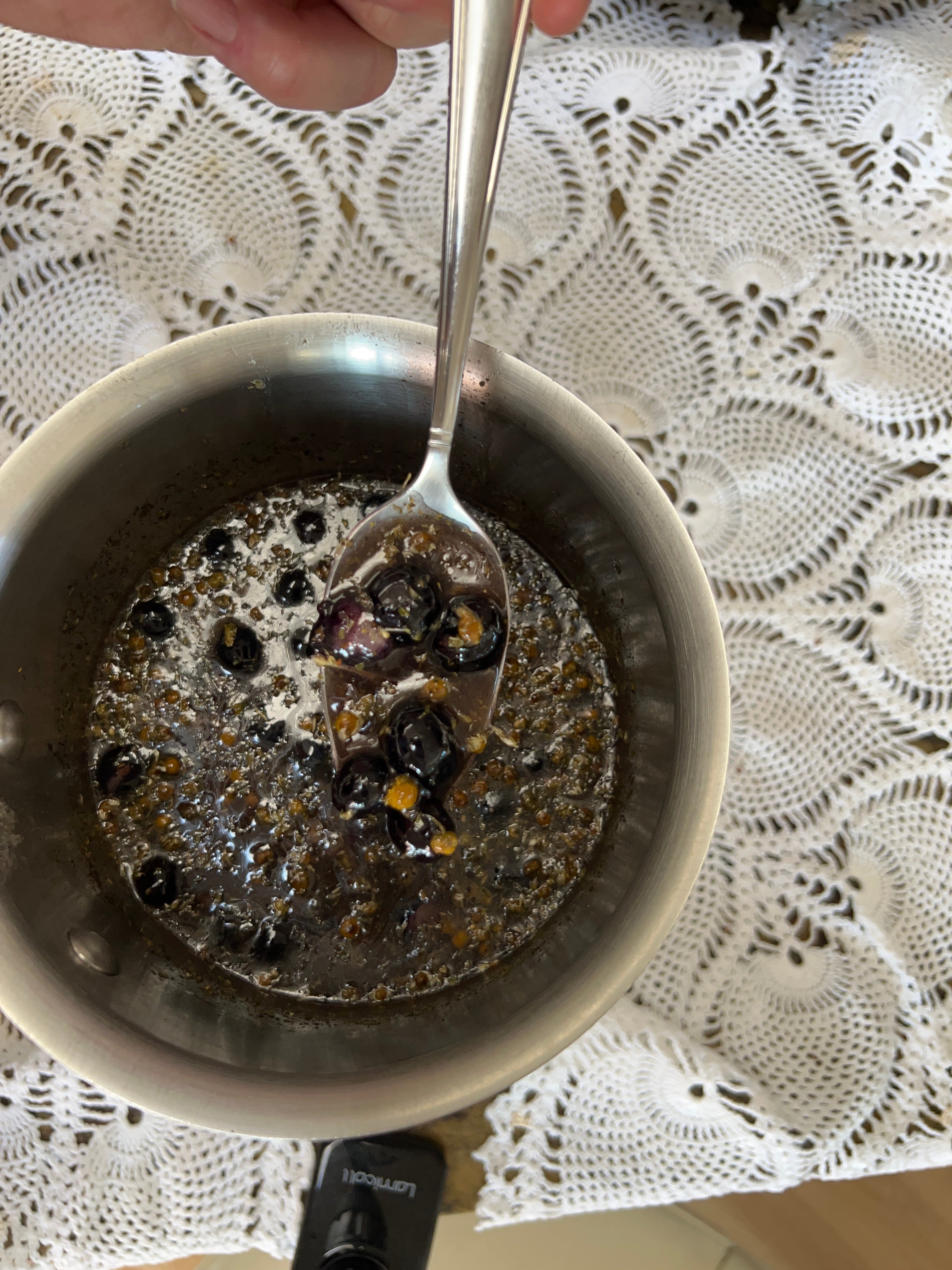A pot simmering chamomile and supportive herbs 