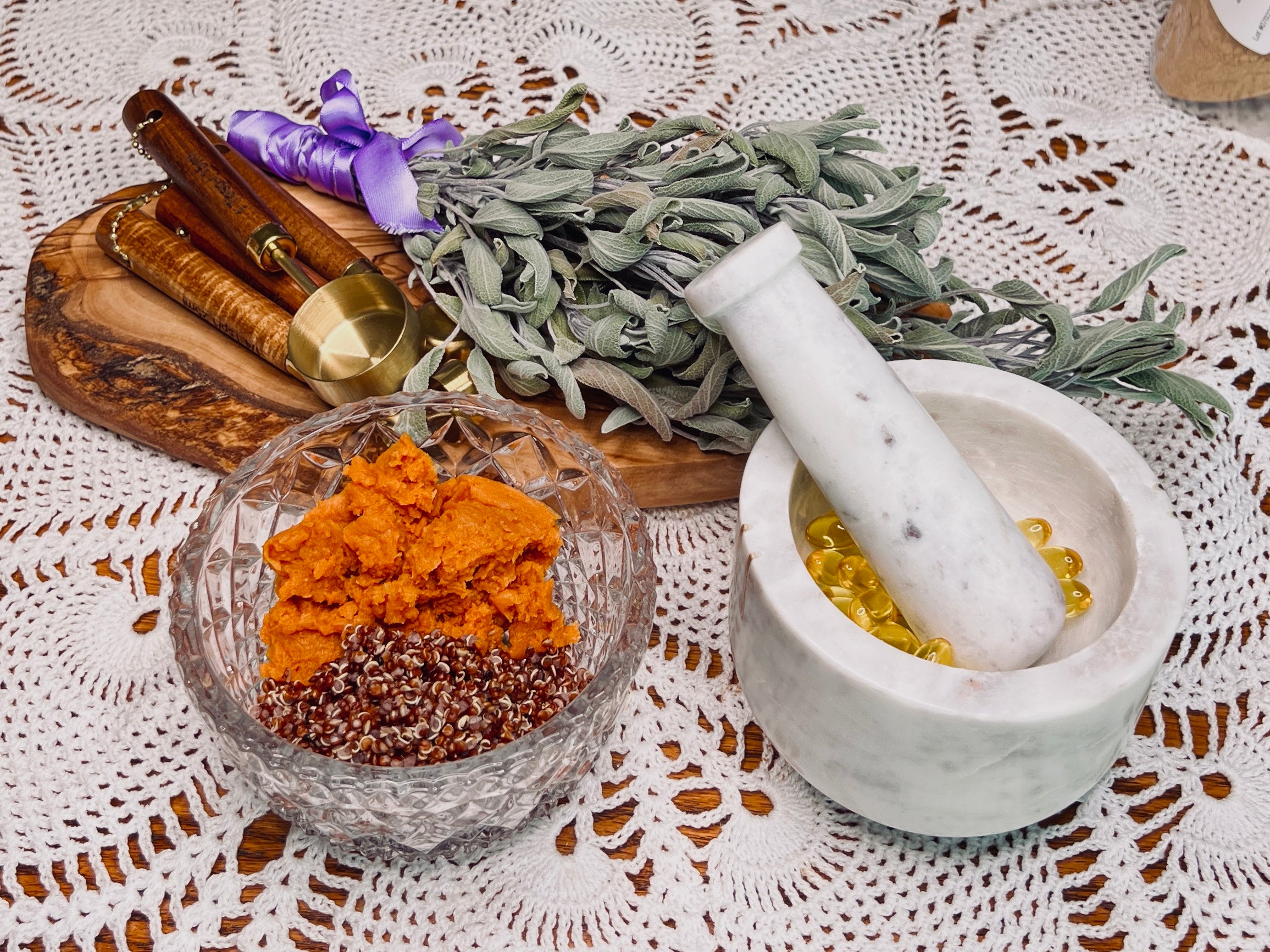 A close up shot of quinoa and pumpkin Pureé along with vitamin e capsules arranged in a vintage style 